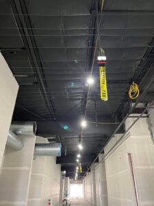 A picture of the caution banner hanging on the roof